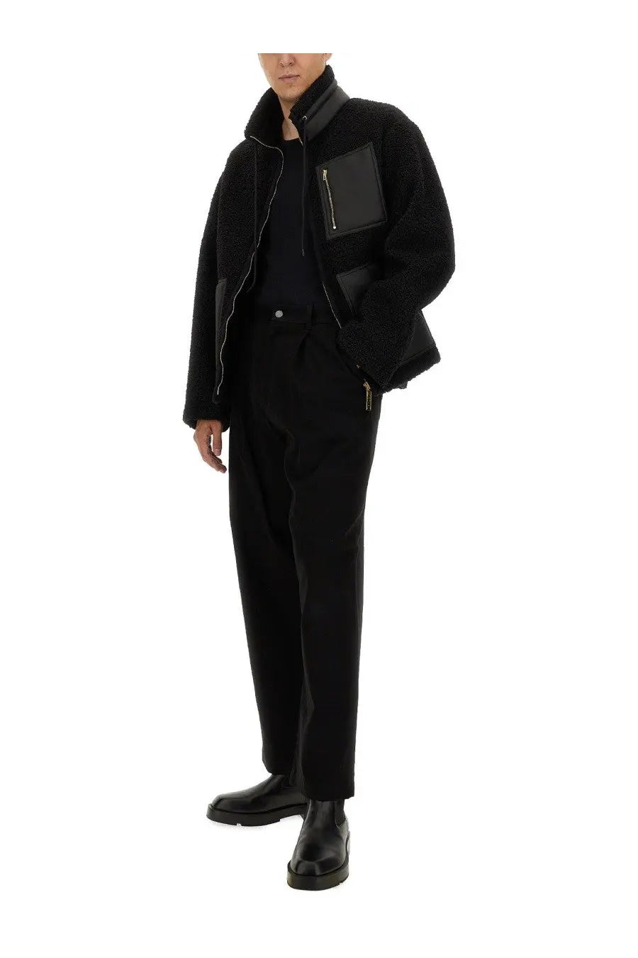 Moschino men’s black shearling jacket with contrasting leather patches and gold zippers on front side