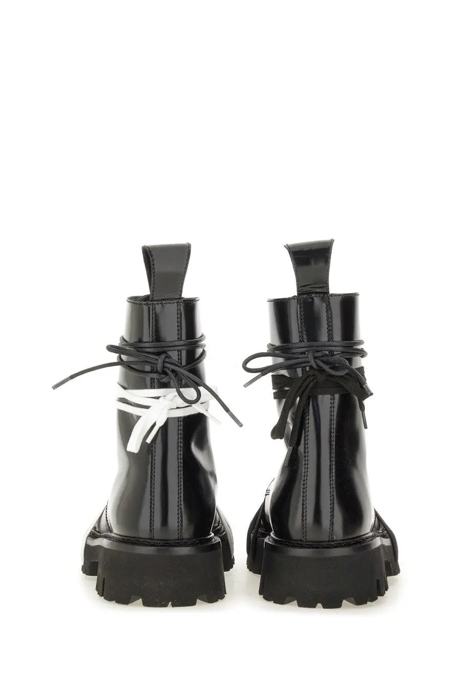 Moschino men’s black patent leather combat boots with contrasting white laces tied in a bow at the ankle