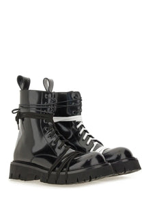 Moschino men’s black patent leather lace up combat boots with white laces and chunky rubber sole