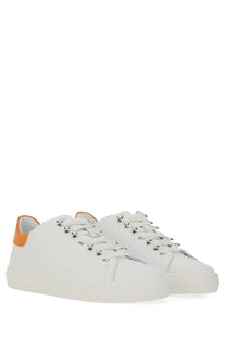 Moschino men’s white leather sneakers with orange heel tabs and silver eyelets for stylish casual wear