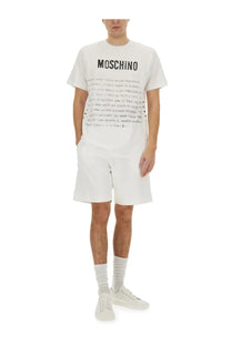 Moschino men’s white cotton t-shirt with bold black lettering and graphic print across the chest