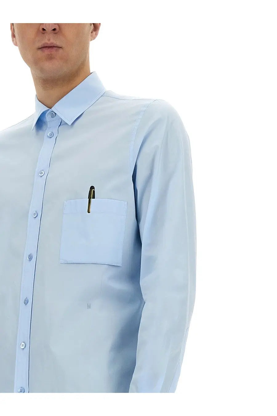 Moschino men’s office inspiration light blue button-down shirt with chest pocket holding a pen