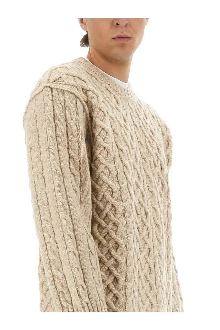 Moschino men’s beige cable-knit pullover sweater with intricate braided texture and classic crew neckline