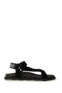 Moschino men’s black suede-look strap sandals with chunky rubber sole and white rhino logo on ankle strap