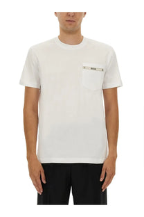 Moschino men’s white cotton t-shirt with chest pocket featuring a silver toned logo band