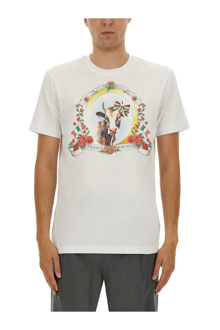 Moschino men’s white cotton t-shirt with colorful ornate cow graphic adorned with ribbons and roses in an oval frame