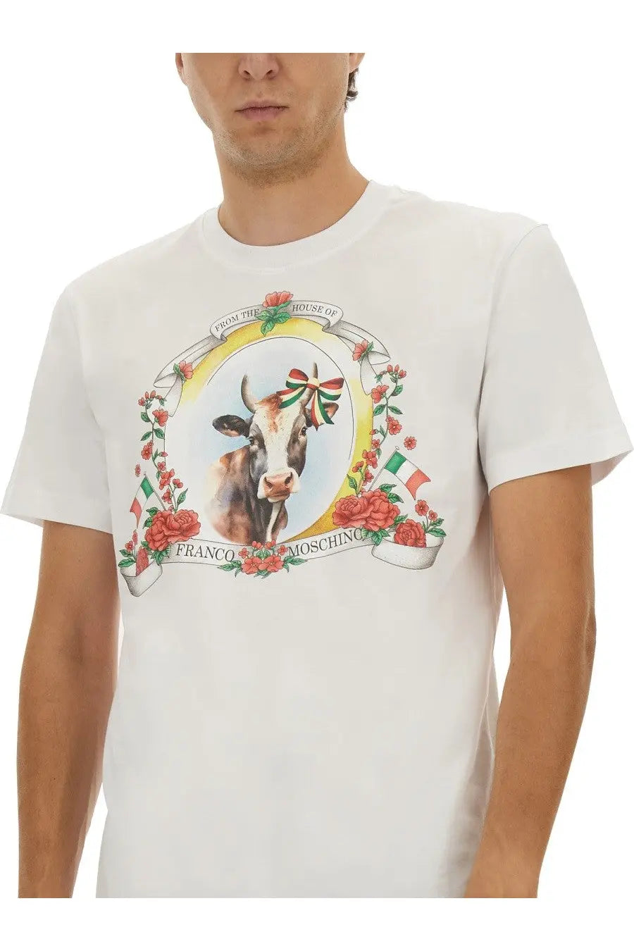 Moschino men’s white cotton t-shirt with a detailed brown and white cow graphic adorned with an Italian flag ribbon