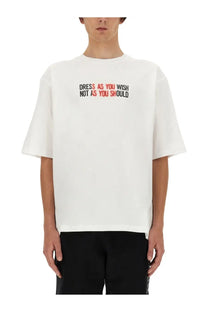 Moschino men’s white oversized short sleeve t-shirt with bold black and red dress as you wish graphic across chest