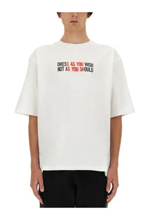 Moschino men’s white oversized cotton t shirt with short sleeves and bold black and red text graphic on chest
