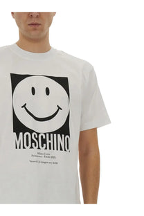 Moschino men’s white cotton t-shirt with bold black and white smiley face graphic and brand name below