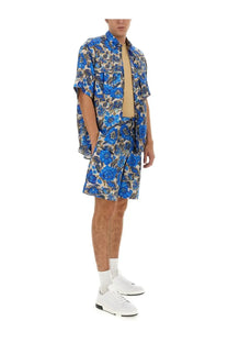 Moschino men’s short blue floral print short-sleeved shirt and matching shorts set in multicolor design