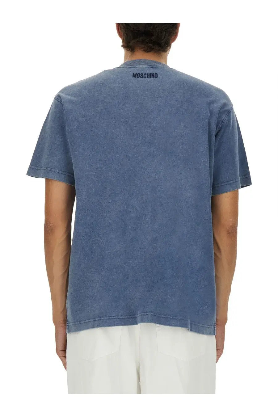 Blue washed cotton t shirt with moschino logo printed in black at the neckline from moschino men’s smiley heavy cotton shirt blue