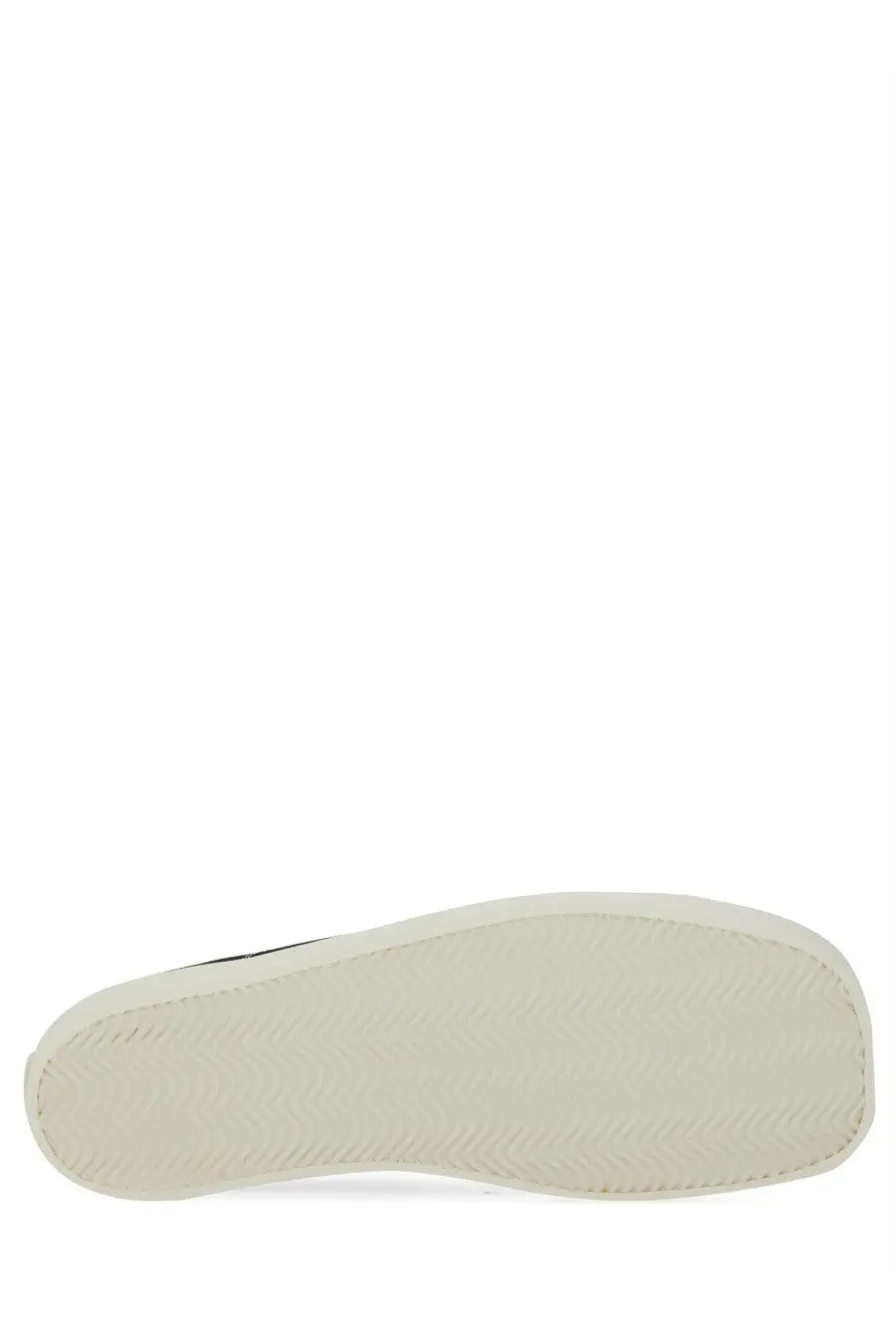 White rubber sole with subtle texture on moschino men’s sneaker edge black for casual wear