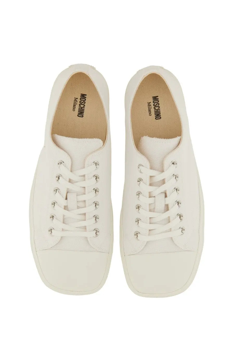 Moschino men’s sneaker edge white canvas low-top with silver eyelets and minimalist design featuring logo insole
