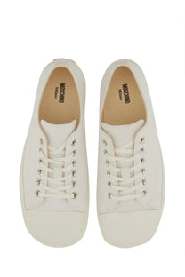 Moschino men’s white canvas low-top sneakers with silver eyelets and minimalist design for casual wear