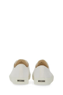 White canvas slip-on sneakers with minimalist design and moschino logo on the heel back side mens sneaker edge white