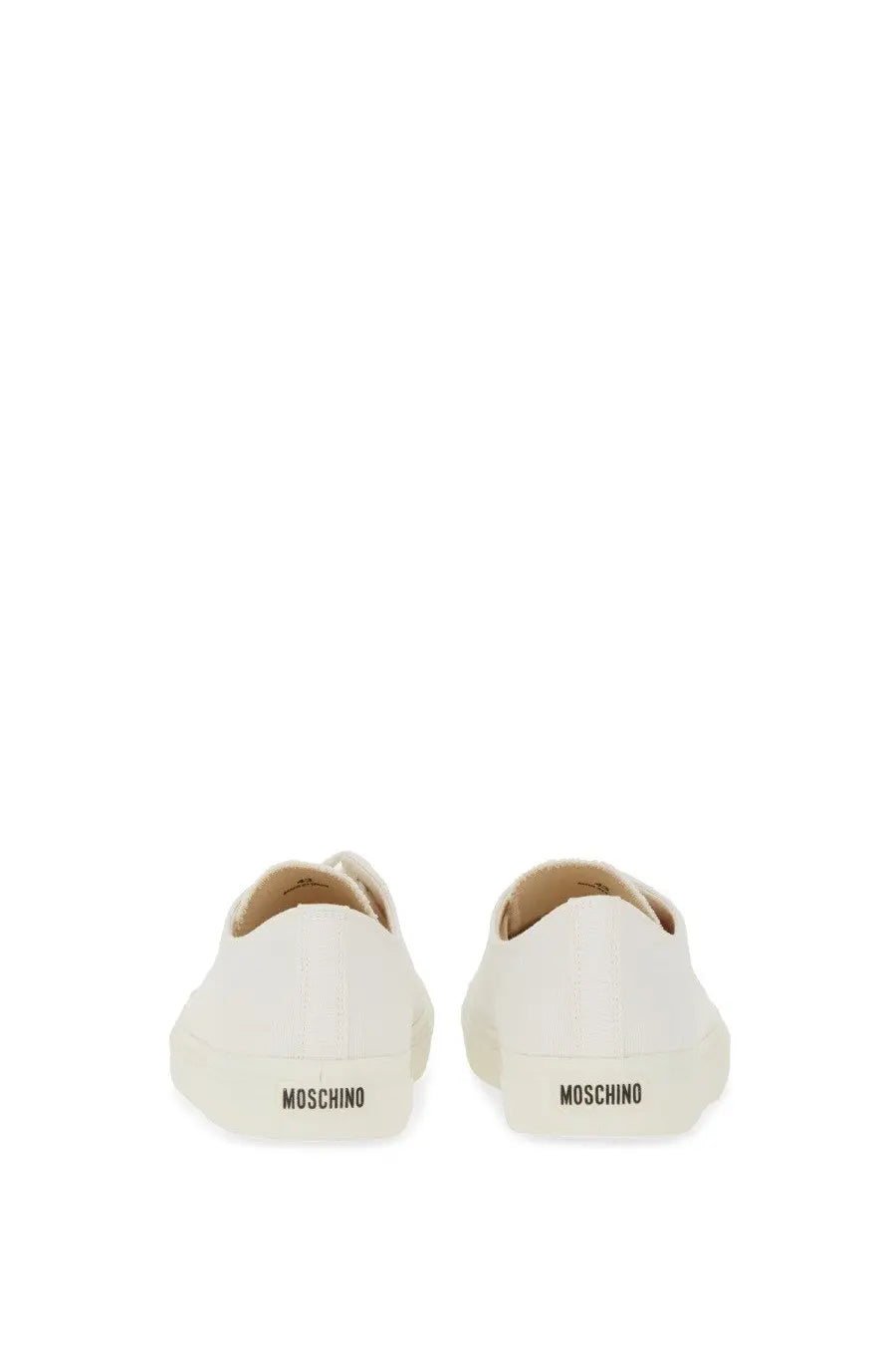 Back view of white leather moschino men’s sneaker edge with minimalist design and embossed brand name on heel