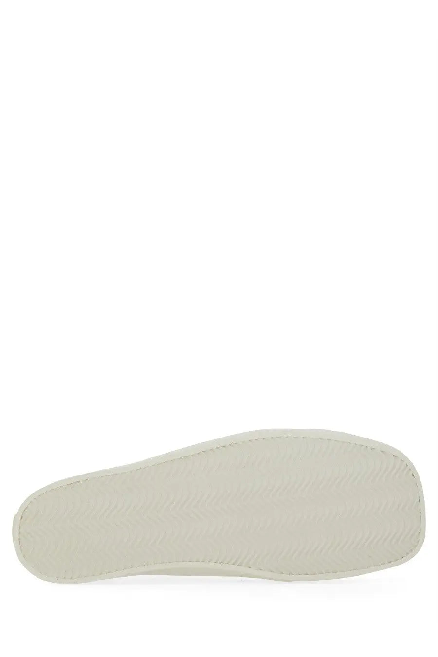 Off-white rubber sole with textured pattern and stitched edges of moschino men’s sneaker edge white