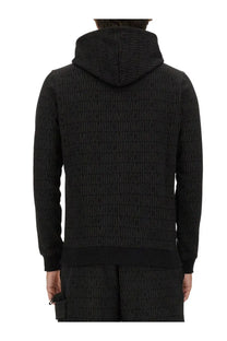 Black Moschino men’s hooded sweatshirt with all-over embossed logo pattern in a soft fabric for casual wear