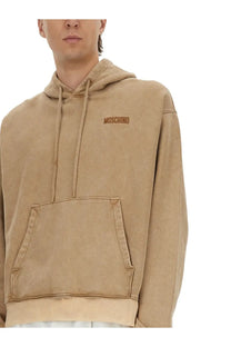 Beige moschino men’s sweatshirt brown hoodie with subtle embroidered logo and matching drawstrings in cotton blend