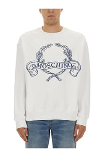 Moschino men’s white sweatshirt with navy blue embroidered logo featuring laurel wreaths and crossed rifles