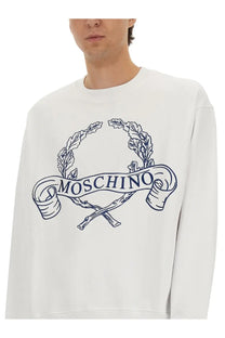 Moschino men’s white sweatshirt with navy blue embroidered logo featuring laurel wreath and crossed sticks design