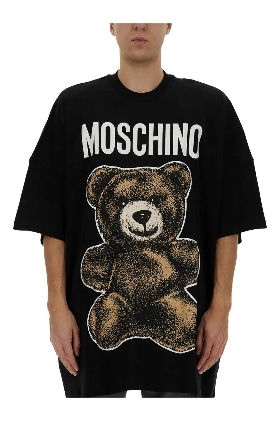 Black Moschino men’s oversized t-shirt featuring a large brown teddy bear graphic and brand name print above it