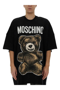 Black Moschino men’s oversized t-shirt featuring a large brown teddy bear graphic and brand name print above it