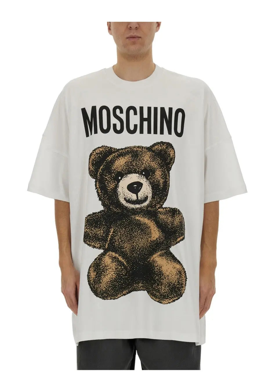 Moschino men’s white cotton t-shirt featuring a large brown teddy bear graphic with black text above it