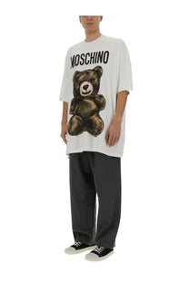 White moschino men’s t-shirt featuring a large textured brown teddy bear graphic with the brand name above it