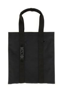 Moschino men’s black tote bag with textured fabric body and matching handles featuring vertical embossed logo