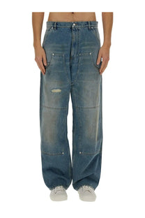 Moschino men’s wide leg blue denim jeans with a distressed faded wash and visible stitching details