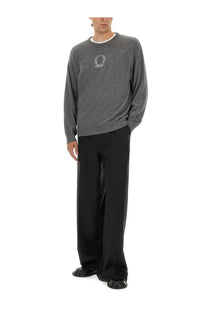Gray textured knit sweater with white embroidered logo on chest paired with moschino men’s black wool canvas pants
