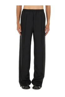 Moschino men’s black wool canvas wide-leg pants with smooth fabric and elastic waistband front view