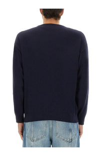 Navy blue knit sweater featuring wool and cashmere blend in moschino men’s pullover design