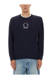 Navy blue moschino men’s wool and cashmere knit sweater with white embroidered laurel wreath logo on the chest