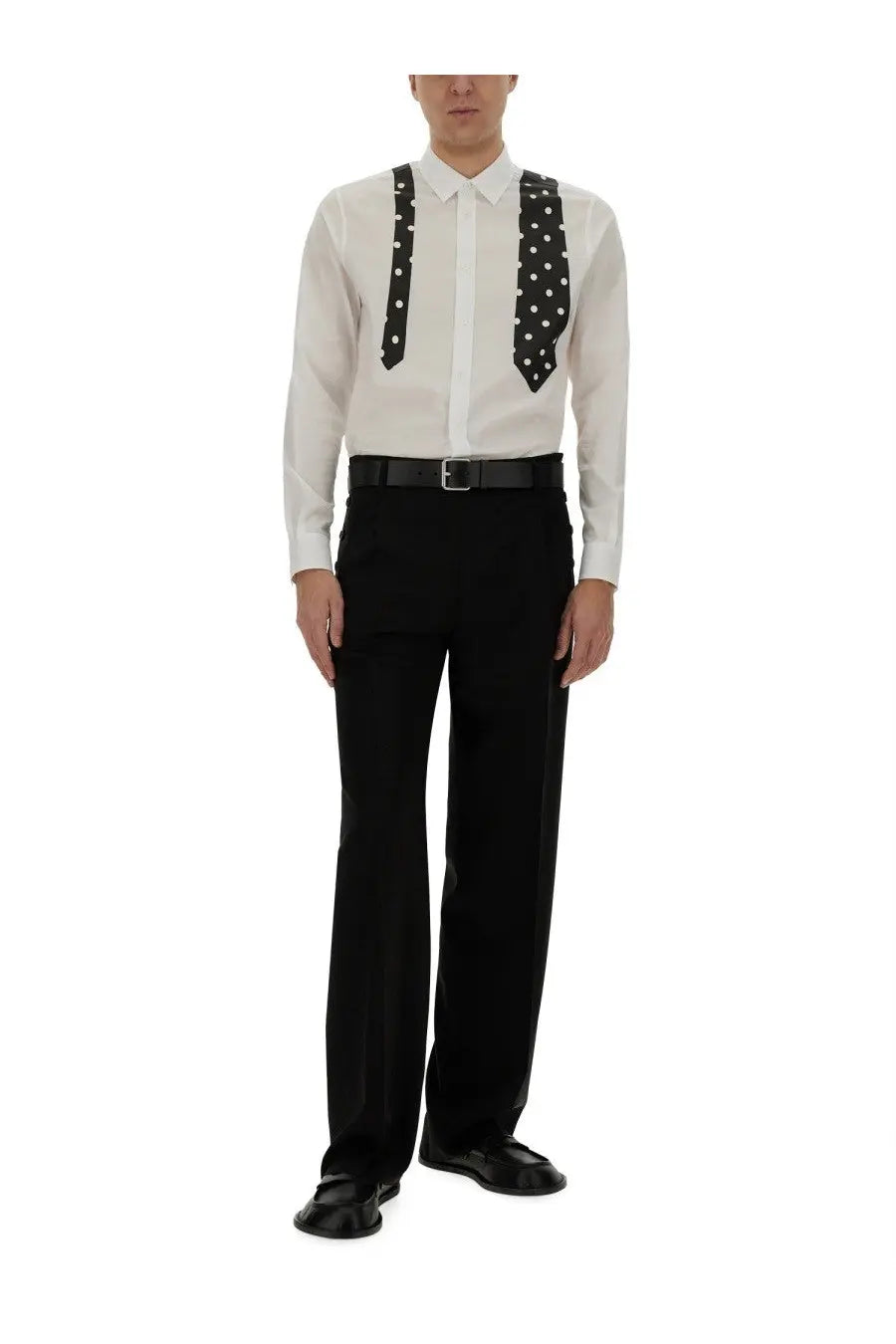 Black polka-dot tie suspenders worn over white dress shirt with moschino men’s black wool pants