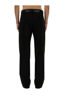 Moschino men’s black wool tailored trousers with a sleek straight-leg cut and subtle vertical pleats