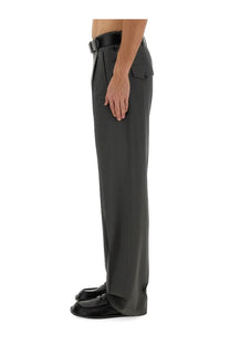 Dark gray Moschino men’s wool pants with a sleek straight-leg cut and subtle pleats at the waistband