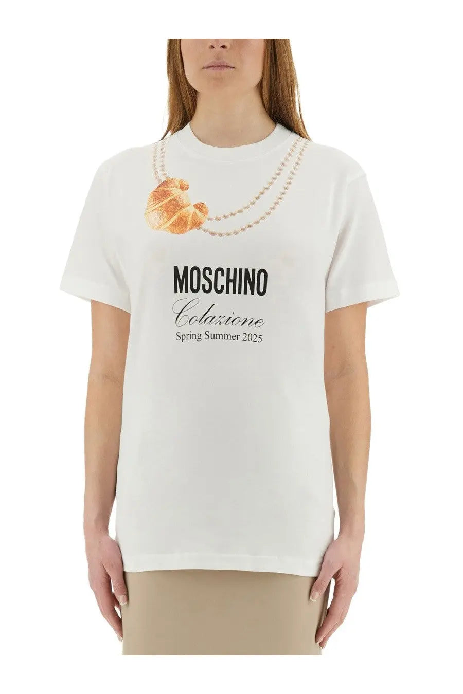 White moschino women’s t-shirt with golden croissant and pearl necklace print featuring moschino colazione spring summer 2025 text