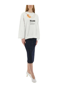 Moschino women’s white sweatshirt featuring a printed croissant and pearl necklace graphic with black text