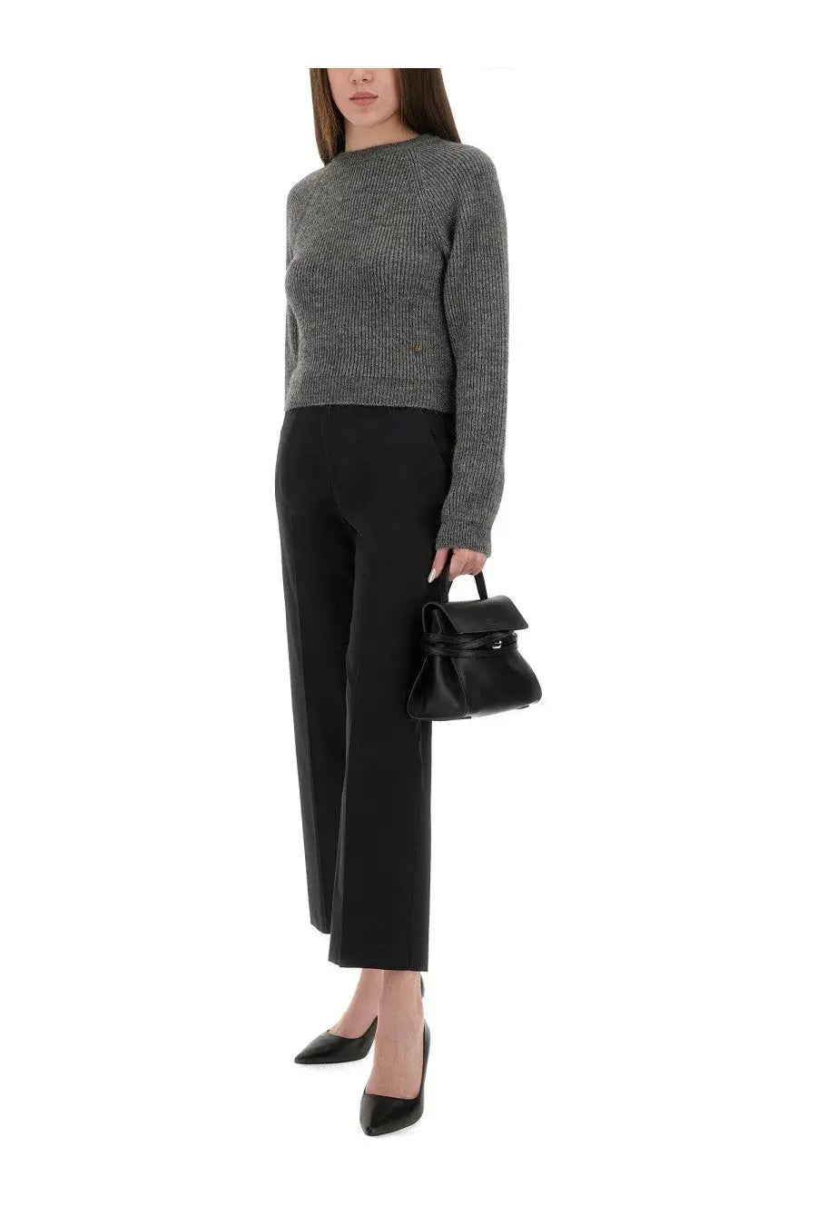 Black leather mini handbag with structured fold-over top and sleek handle shown with Moschino womens cropped grey shirt