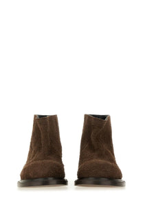 Moschino women’s crust Olivia boot brown brown suede ankle boots with matte finish and black rubber soles