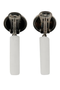 Moschino women’s white rectangular pendant earrings with silver-toned clip back fastenings