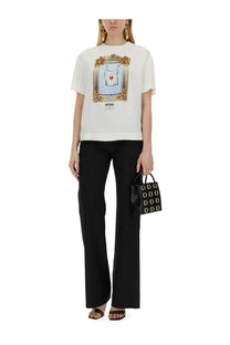 Moschino women’s white t-shirt featuring a framed graphic of a white dress with a red heart on the front