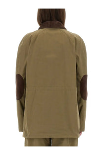 Moschino women’s heavy cotton jacket in olive green waxed cotton with brown corduroy collar and elbow patches