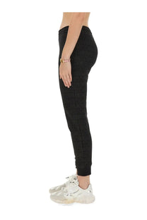 Black Moschino women’s jogging pants with textured repeating logo pattern perfect for casual wear