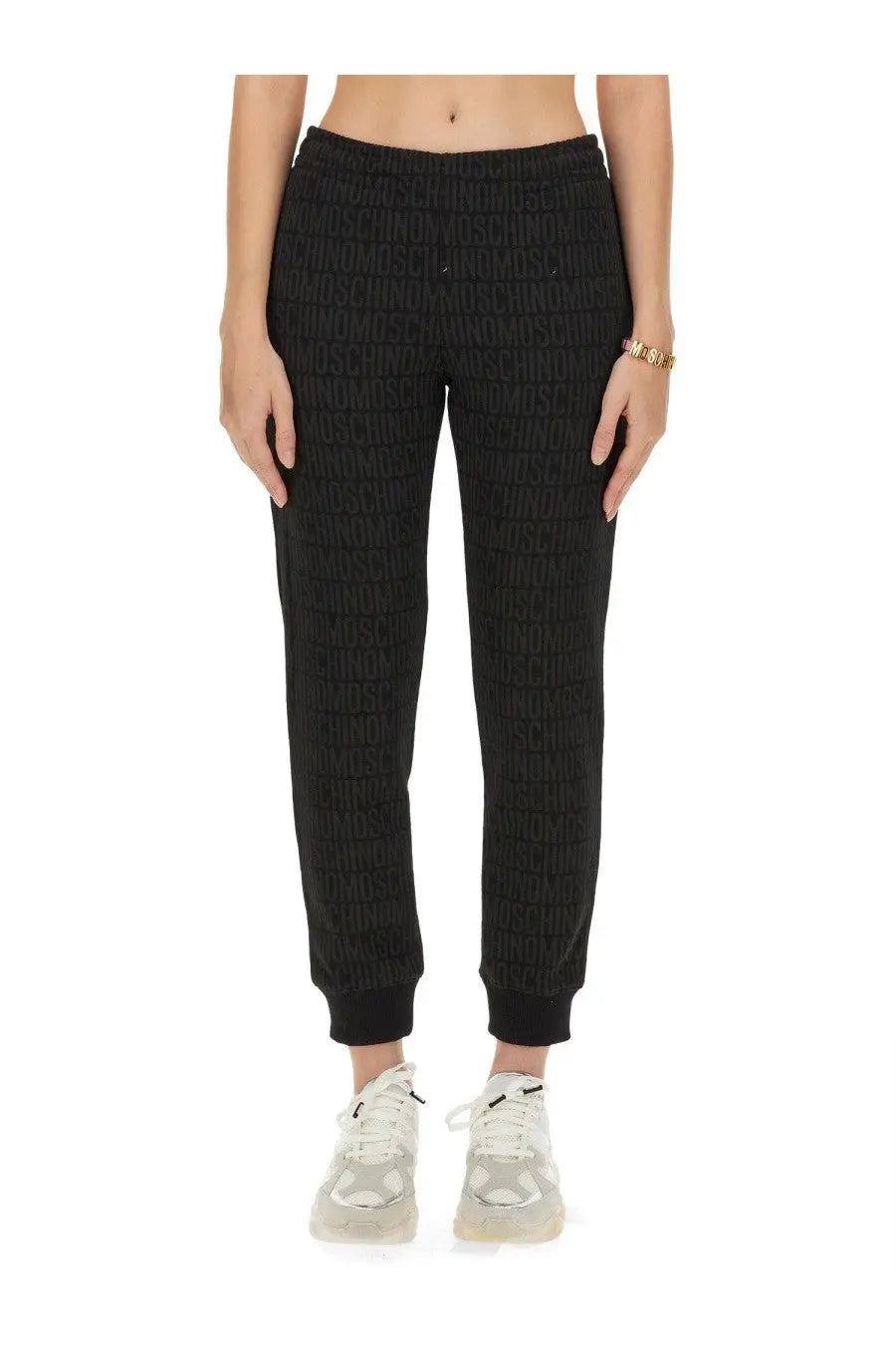 Moschino women’s black joggers with a subtle textured weave featuring a repeating love logo pattern