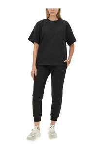 Black ribbed knit two-piece set featuring joggers and a matching top by moschino women’s casual wear