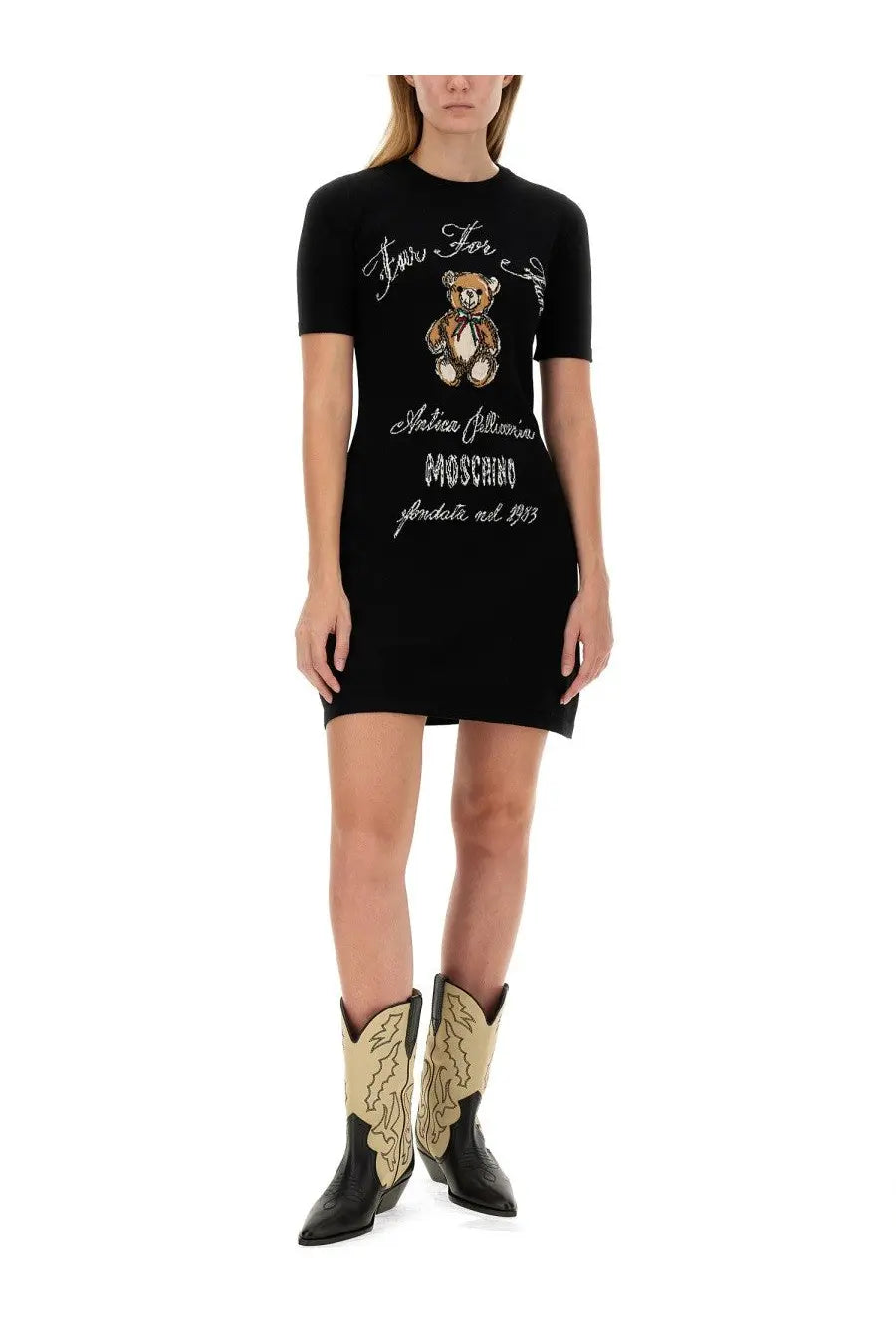 Black short-sleeved Moschino knit dress featuring embroidered teddy bear and script text on the front
